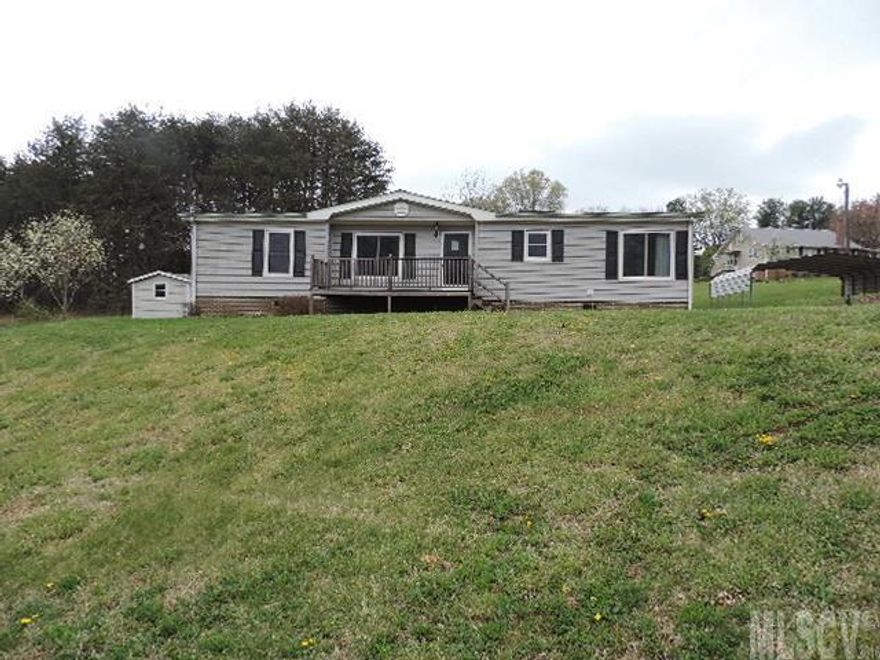 Nice three bedroom two bath house with plenty of potential in quiet neighborhood. Sits on .80 acre. Great value priced well below tax value.