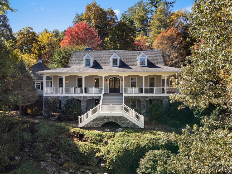 A Custom Storybook Estate situated on 11+ private acres with just under 700 feet of French Broad river frontage.  You will love the driveway graced with hemlocks and other beautiful trees. A well maintained home boasts thoughtful details throughout. Custom antique heart of pine and slate floors, custom wrought iron details, a built-in lighted reading nook, 100 year shingles, custom kitchen cabinets, and wrap around porch are just a few of the property's highlights.  Great outdoor spaces,  flagstone patio, and a fenced in area for your pet. The lower level has additional entertaining space and storage.  There's room for your workshop or crafting area with a utility sink.  Three miles to downtown Brevard. 
WEBSITE address.  https://listings.wncrealestatephotography.com/sites/dbbnegl/unbranded