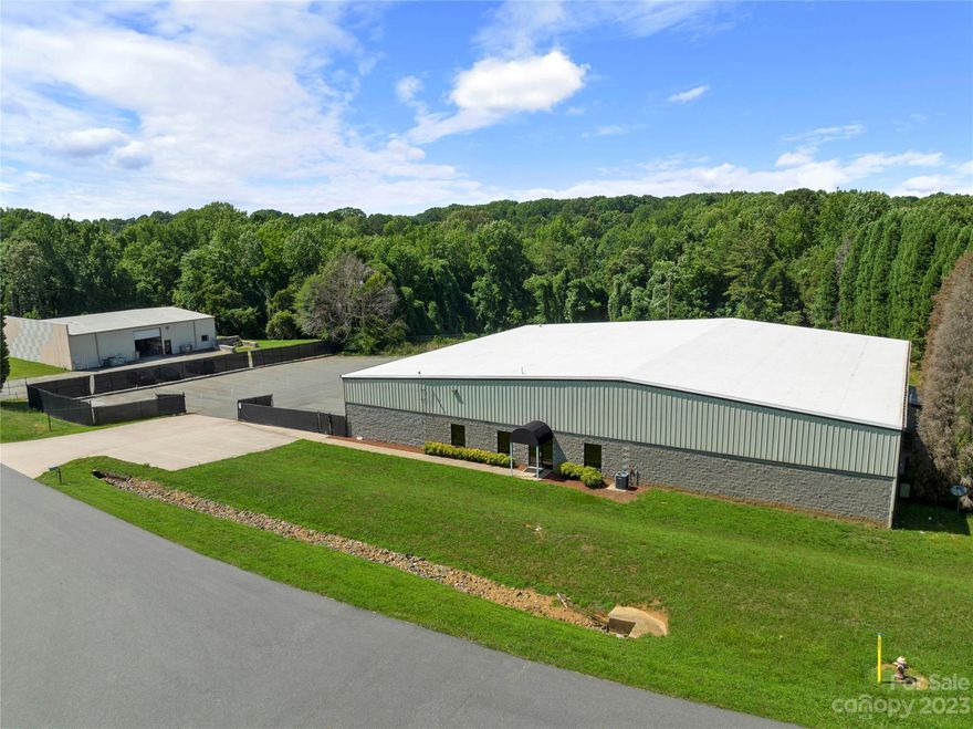 Investment Opportunity  /  New 5 Year Triple Net (NNN) Lease  /  12,500+ SF Industrial Building Available For Sale in South Iredell Industrial Park off Mazeppa Rd in Mooresville  /   2,950 SF of Office Space  /  8,668 SF of Warehouse  /  882 SF Flex Space  /  PLUS 1,896+ SF of Mezzanine Space  /  Zoned IN  /  3.42 Acre Property  /  Gated Employee Parking  / 1  - Large Drive-in Door  /  1 - Loading Dock Door  /  Easy Access to I-77, Hwy 21 and Hwy 115  /  Approx. 3 miles from future Cornelius Rd exit on I-77