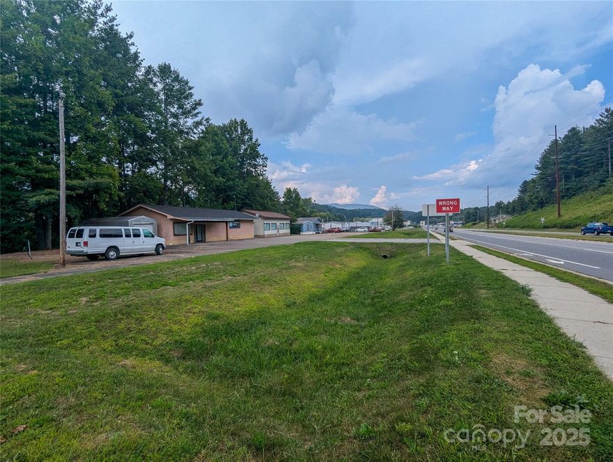 High Visability with frontage on US Hwy 19E ByPass, this 1.140 Acres includes 3 separate frame structures that are presently rented. Building @ 515 East US Hwy !9E ByPass (The Gathering Place) was built in 2001, no records found on other buildings. Property is zoned Commercial and suitable for multiple commercial uses.  Crabtree Creek flows at rear of property and some portions are located in floodway/flood zone.  US Hwy 19E ByPass is 4-lane divided Highway and heavy traffic area for business opportunities.  Great location near dowtown Burnsville for your business!  Property is included in total property offered for sale in MLS #4061541 - 4.37 Acres offered for $2,550,000 but can be sold separately if desired!