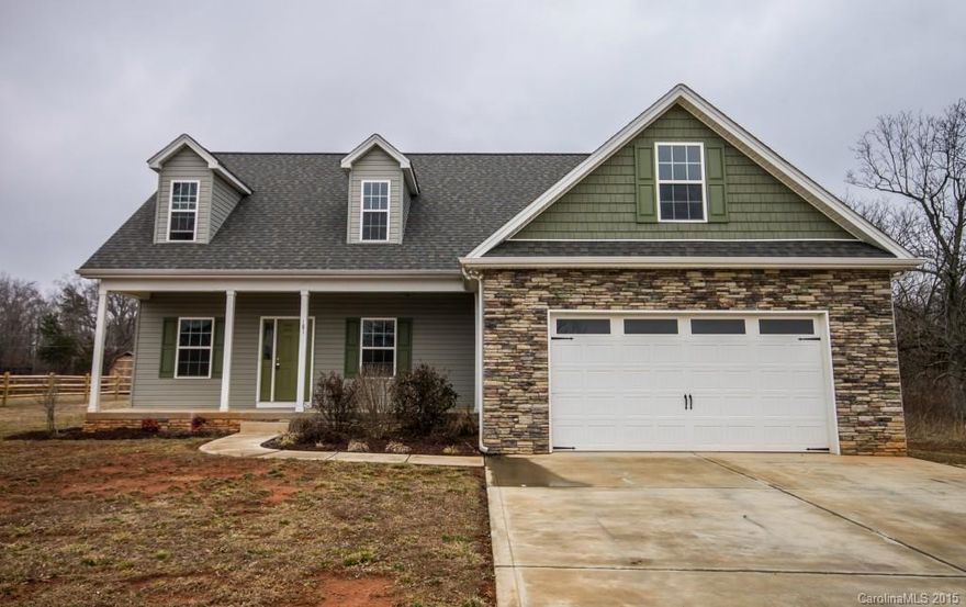 Stylish, like-new home!  HW flooring greets you & continues into Main Level Office w/privacy door & GR w/gas FP & lighted fan. Kitchen features sleek granite, backsplash, Cherry cabs, SS appls, electric cooktop, dual ovens & eat-in bar, plus Brkfast area w/deck access.  Master down floorplan w/HUGE WIC, dual vanities, tub, sep tiled shower & tile floor. Upper level Bonus Room flanked by 2 BRs & tiled Guest Bath. Deck overlooks .54 ac lot. Easy access to I-77, Troutman Lowes & more.