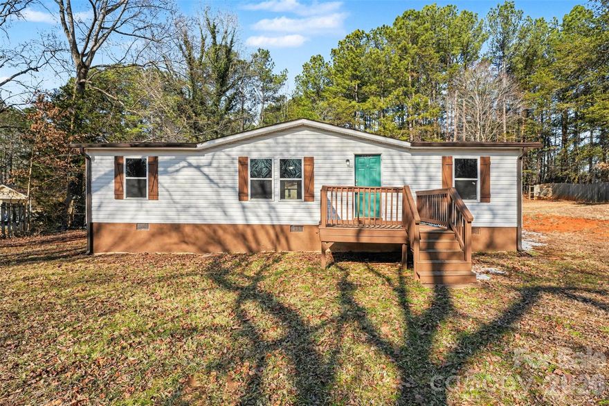 Don’t miss this move-in ready 3 bedroom, 2 bathroom home ideally perched high within the community, offering an exceptional setting and beautiful views. This property provides an elevated feel that truly sets it apart.  Just minutes away from Lake Norman, this location can't be beat.

Inside, enjoy new flooring throughout and a remodeled kitchen featuring stainless steel appliances and a smart, open layout that maximizes space.  The thoughtful floor plan creates an airy, welcoming atmosphere that truly feels like a traditional home—not a manufactured one. Situated on a permanent foundation, this home offers peace of mind and long-term value.

Conveniently located near Lake Norman and Mundy Creek, this property offers easy access to water activities, recreation, and the relaxed lifestyle the area is known for.

An additional dwelling on the property presents an exciting opportunity—with a little TLC, it could serve as rental income, a guest space, or extended living options.