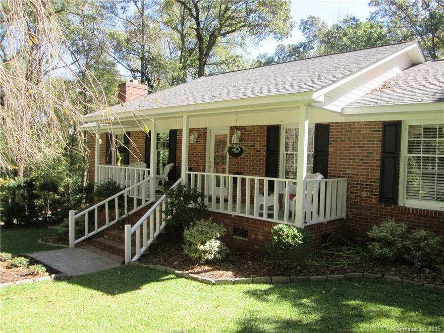SEE AGENT ONLY REMARKS Beautiful custom 2BR/2BA brick ranch. In a wonderful private setting this home has a rocking chair front porch, large relaxing screened porch with a large patio that surrounds the in-ground pool and hot tub.  Koi pond and fire pit round out a year round outdoor entertainment area. The interior is inviting you to entertain - the today kitchen has granite, newer SS appliances, work island and more. Master has garden tub with separate shower. Attached and detached garage.