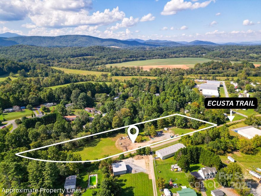 Discover 2.45 acres in the heart of Etowah with rare direct access to the Ecusta Trail. Situated off Morgan Road, this property connects you directly to the 19-mile trail that will link Hendersonville to Brevard, offering miles of walking, biking, and outdoor enjoyment through scenic WNC landscapes. With gentle topography and plenty of space to design your vision, this parcel is an exceptional opportunity for a homesite or investment in one of the region’s most exciting growth areas.