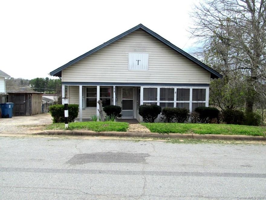 Charming vinyl Bungalow with screened porch and partial cellar basement.  Privacy cedar lined back yard with large and small utility buildings....Great location...minutes from Hickory, Lincolnton, local shopping and dining! Needs just a bit of TLC to make this the perfect starter home!