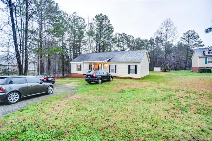 Why rent when you can own for less! 100% financing available on the wonderful 4 bedroom 2 full home on over an acre of land! Enjoy relaxing on the front porch or have friends and family over to enjoy the large kitchen and connecting dinning room space. Looking for land and a wonderfully maintained home for less than rent? You have found it!