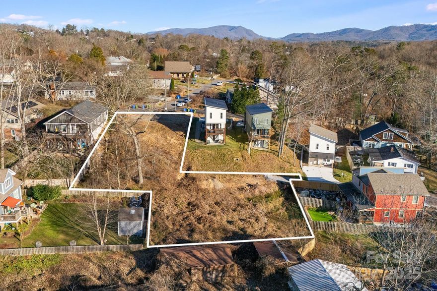 Build for Rent Multi Family Opportunity - up to 10 units. West Asheville RM8 development opportunity with extensive site work already completed. This .41-acre property includes four engineered building areas supporting up to 10 total units per the current layout: three units each on the two eastern pads (101 & 105 Arline Henry Way) and two units each on the two western pads. The site has undergone major improvements including substantial grading, significant imported and compacted fill dirt, full stormwater installation, new sewer line extension with one new manhole, retaining walls, tree clearing, and utility preparation. Final pad cuts have not yet been made, allowing the next owner to shape each building area to fit their design needs. Entitlements are approximately 99% complete, with only updated stormwater calculations being finalized and no anticipated changes to the approved layout or density. RM8 zoning allows a wide range of small multifamily formats including duplexes, triplexes, and attached product. Seller financing is available. A rare infill development site in a highly desirable West Asheville location. Seller is a NC Licensed Real Estate Broker.