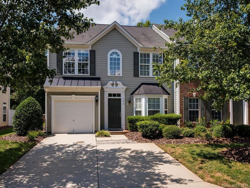 Don't miss out on this END UNIT townhome in Fort Mill. This spacious & open floorplan features all new carpet, fresh paint, tile in all wet areas & bright sunroom. The kitchen offers corian countertops, tile backsplash, upgraded cabinets, smooth-top range and refrigerator. Gas fireplace in great room. Gorgeous owner's suite with tray ceiling, garden tub, separate tile shower & walkin closet. Huge secondary bedrooms. Flat yard w extended patio, privacy fence & woods in rear. Community pool.