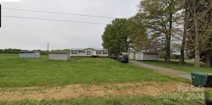 Doublewide mobile home on .65 Acres.  Peaceful setting in this remote location.  Sold as is.