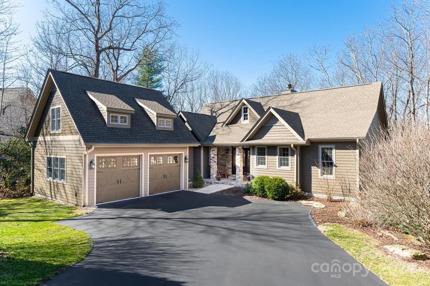 Absolutely Stunning! This exceptional home offers the perfect blend of elegance, comfort and luxury mountain living. Located in Kenmure-a prestigious gated golf course community and situated on 1.5 private acres with mountain views. This home features extensive interior and exterior upgrades. The main level boasts spacious open floor plan, great room with vaulted ceiling, floor to ceiling stone fireplace, wall of windows, chef's kitchen with newer high-end appliances, granite tops, breakfast bar and pantry, luxurious spa-like master suite with tray ceiling, dual walk-in closets, unbelievable wet spa, heated tile floors and floating double vanity, gorgeous sunroom, dining room with tray ceiling, laundry with sink and powder bath. Lower level features family room with fireplace, 2 en-suite bedrooms, flex space and plenty of storage. Relax at the end of the day on the multi-level deck, screened or front porch. 2 car garage plus golf cart garage. Luxury mountain living at its finest!