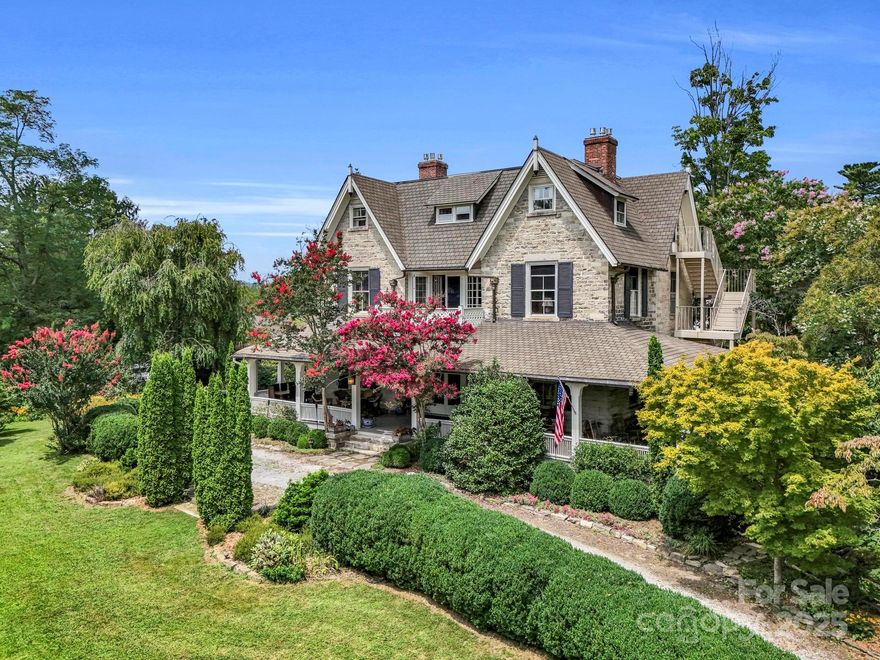 Discover the Killarney House, a Gothic Revival estate on over an acre and walkable to downtown Hendersonville, NC. This NINE-bedroom, SIX-bathroom home offers historic charm with modern luxury, making it ideal for a family or as a BNB investment. Built in the 1850s with an early 1900s addition by Richard Sharpe Smith, the architect of the Biltmore Estate, this home features expansive porches, original granite walls, copper gutters, and eight natural gas fireplaces. Modern updates include central heat/air, renovated kitchen and bath, and 220V outlets in the outbuildings. The lush gardens with 196 varieties of flora create a serene oasis. Only 30 minutes to Asheville, less than one hour to Greenville and surrounded by beauty and amenities! Expansive porches, sitting rooms, a study, and a large dining space allows for endless hosting and plenty of room for guests and holiday parties. So many features with little space to describe, ask for the 3D Tour, videos, and numerous feature sheets!