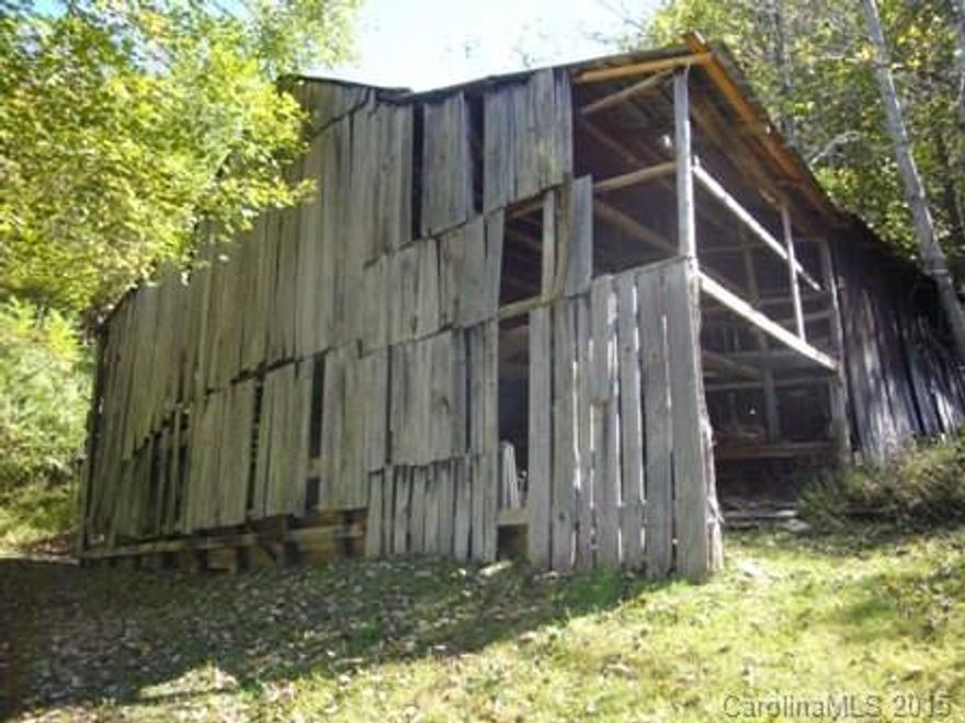 11.49 Acres With a 2 bedroom, 1 bath Log Home, Barn and Several Outbuildings. Some Pasture, Some Wooded. Several Building Sites Higher Up. Year round mountain views
40 Minutes to Downtown Asheville.