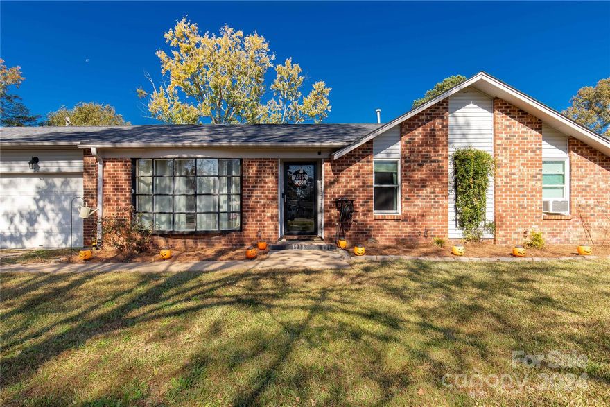 Have you said to yourself that you'd love to live 5 minutes from everything, but you still want privacy! We got you...drum roll please! This home is located in Rock Hill, in close proximity to Hwy 21, Hwy 5 & I-77, yet tucked away in a cozy culdesac and situated on 1.7 acres. This 3 bedroom, 2 bath home features a den, living room with a fireplace, & open to the kitchen and dining area. As you walk out the back door you'll love the gesture of the covered patio and the huge fenced back yard. Bring the fur babies or the baseball team, either way, this yard is large enough to host all of your interests. Not only the yard, but this home also has a 2 car garage. Location, location, location - enjoy the best of both worlds while having privacy at home, but within minutes of shopping, restaurants, work, or entertainment while exploring all Rock Hill, Fort Mill or Charlotte has to offer.