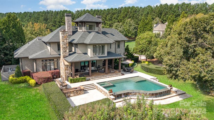 Discover your luxury dream home with DEEDED BOAT SLIP at The Point. This stunning home on 1.24 acres features immaculate views of the scenic 14th Green at Trump National Golf Course and views of Lake Norman. The state-of-the-art kitchen boasts Wolf and Sub-Zero appliances, elegant quartzite countertops, and custom limestone and zinc range hood. The upgrades continue throughout including luxury fixtures, new carpet, grasscloth wallpaper, pet wash station, custom cabinetry and window treatments, and new driveway extension. Enjoy outdoor living in your saltwater infinity pool with heated spa, built-in grill area, and covered terrace with wood-burning fireplace and built-in speaker system. Too many features and upgrades to list! New roof and gutters (2023) and HVAC systems (2021 and 2022). Don’t miss this one-of-a-kind opportunity to experience luxury living at The Point!