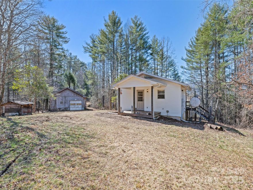 UPDATE: Sellers will consider owner financing with approved background and credit check! 
Opportunity awaits in beautiful Fines Creek! This Clyde, NC home, situated on a generous 3.94-acre lot, is ready for your renovation expertise. Ideal for investors, flippers, or those looking for a project with substantial upside. Enjoy the peace and privacy of this lovely acreage, complete with a detached garage and storage shed for all your tools and toys. Don't miss this chance to create your dream home or profitable investment!