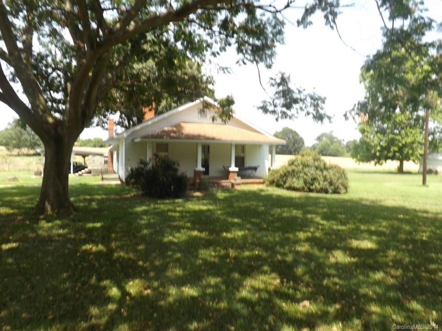 Nice older home located just outside of Marshville city limits. Rocking chair front porch. Old barn and pasture land. Hard to find home in this great location with 3.5 acres.