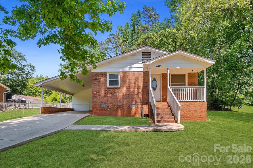Beautiful full brick ranch featuring 3 bedrooms and thoughtfully updated throughout, making it truly move-in ready. The kitchen offers a tile backsplash, ample cabinetry, and a comfortable eating area. Interior highlights include crown molding throughout, new blinds, fresh paint, and updated lighting fixtures. Major systems have been recently replaced, including the roof, HVAC, and water heater—all within the last 5 years. A moisture barrier has been installed in the crawl space for added peace of mind. The laundry area is conveniently located in the utility room off the carport, complete with heating and air, shelving, and cabinets. Enjoy the large fenced yard, perfect for a pool, play area, or relaxing outdoors. A rare find that feels practically like new.