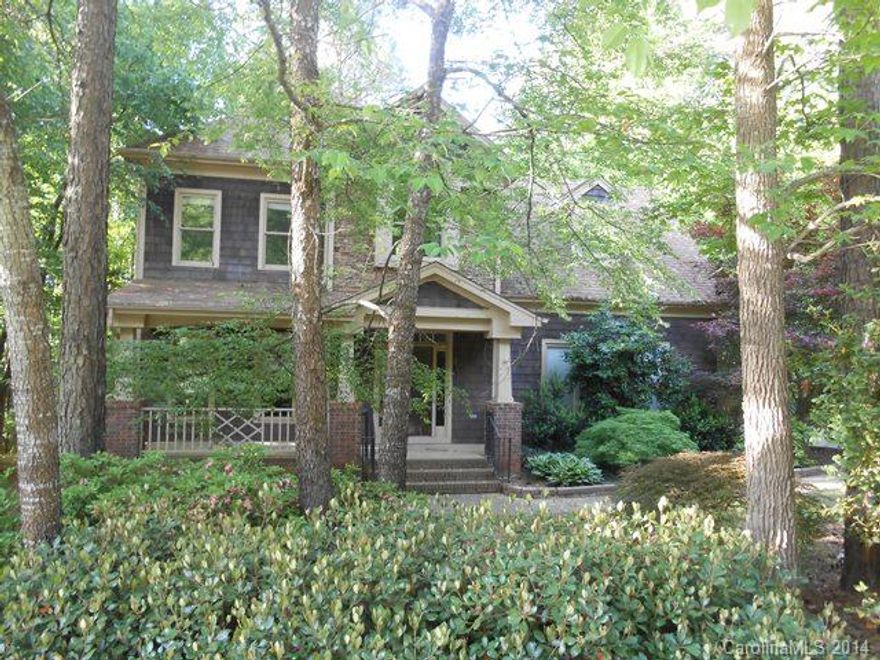 Mooresville cedar shake and stone home with over 2300 Sq Ft of Living Area. Open floor plan with wood burning fireplace in great room. Kitchen w/granite counters, tile backsplash, and stainless steel appliances. Hardwoods on the main floor, upstairs hall, and owner's suite. Large deck that overlooks private backyard. Irrigation system included. Comes with Deeded Boatslip #143.  Great Neighborhood!