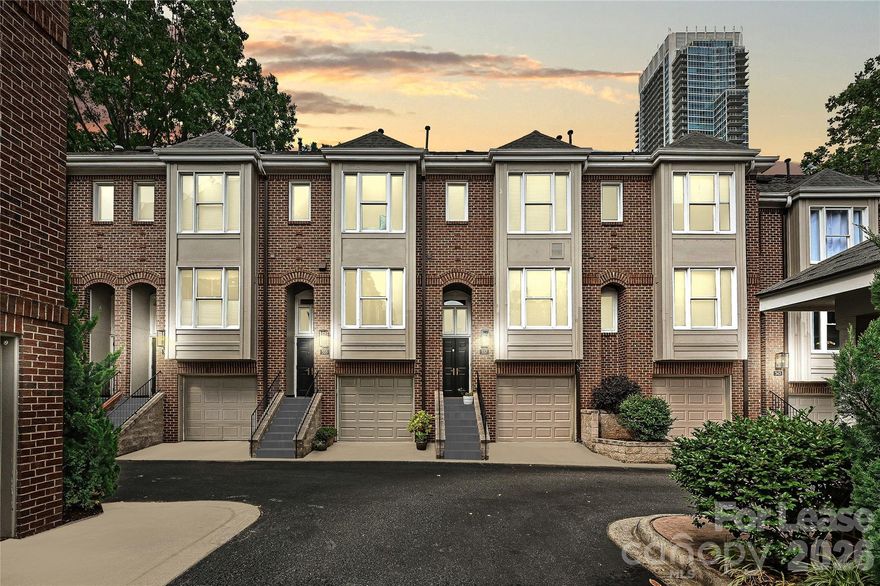 A rare opportunity in one of Charlotte’s most coveted locations! This beautifully renovated townhome sits directly on the scenic 3.5-acre Historic Fourth Ward Park, offering a unique blend of tranquil green space and vibrant city living. Centrally located in Uptown Charlotte, the home features thoughtful updates throughout, including a recently renovated kitchen. The primary bedroom boasts vaulted ceilings, while the cozy living area is enhanced by a gas fireplace. Additional highlights include a one-car garage and a private terrace with stunning views of both the park and the city skyline. Enjoy the best of city living with the charm of a historic neighborhood—just two blocks from Tryon Street and within walking distance to the Panthers Stadium, Spectrum Center, restaurants, nightlife, performing arts venues, grocery store and more. The home offers flexible living spaces with two full bedrooms on the second level, a bonus/guest room on the lower level, and a versatile home office or kids’ room on the top floor. This is truly a rare find that delivers both a neighborhood feel and unbeatable access to everything Uptown has to offer.