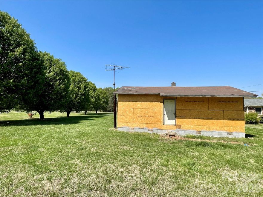 LOOKING FOR LAND? Here's 3 separate parcels being sold together totaling approximately 4.52 acres off of Dallas Cherryville Hwy WITH a small, ranch style house that has been gutted~ giving the NEW OWNER a blank canvas to work with and renovate to their specifications! Property does have 100 amp electric, septic and shared well per seller. Well agreement, deed and plat maps showing all 3 parcels are uploaded in the media section of this listing. Selling AS IS. Use caution when viewing property~ especially at the front door as there isn't any permanent steps leading to the door. No Electricity. The tax value stated is for all 3 parcels combined.