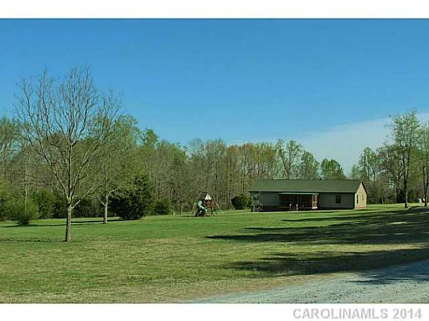 Fabulous modular w/vinyl cedar shake exterior on 6ac. New HVAC. Open floor plan. Wood burning, stone fireplace. Screened porch. Deck. Master bath w/garden tub & shower. Whole house, 125 amp generator. Fully sealed crawl space, moisture free. 3 wells. 2 septic tanks. Level yard w/400' road frontage. Transferable, lifetime Vanderbilt warranty. 20x19 metal bldg w/overhead door. Area to be filled & seeded where above ground pool previously existed.