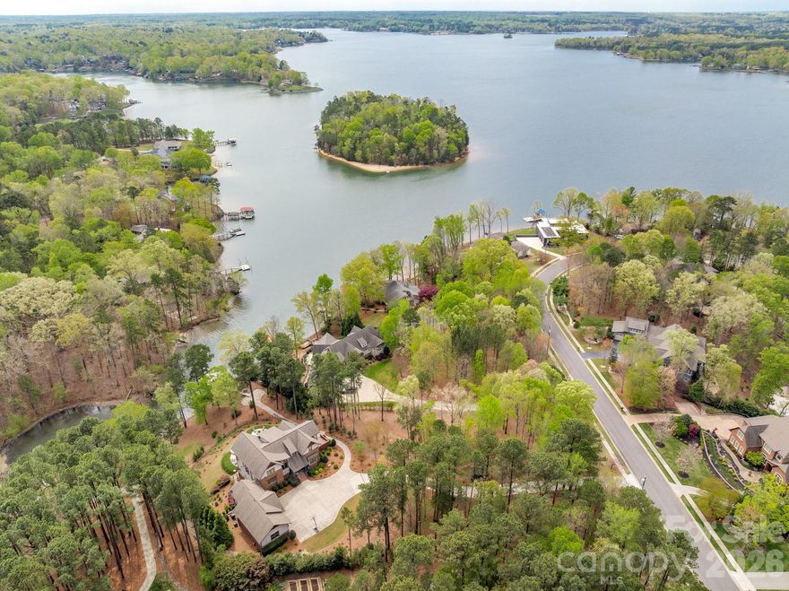 Experience exceptional waterfront living on the shores of Lake Wylie in this stunning 2016 Arts & Crafts-style home. Offering over 5,000 square feet of thoughtfully designed living space, this 4-bedroom, 4 full and 2 half bath residence blends timeless craftsmanship with modern luxury.

The main level features an open-concept layout anchored by a dramatic two-story living room with a soaring fireplace, creating a striking focal point filled with natural light. The chef’s kitchen is equipped with a gas cooktop, double ovens, and premium appliances, while the elegant dining area is perfect for entertaining. The primary suite on the main floor provides a private retreat with a spa-inspired bath, and a utility room plus additional half bath add everyday convenience.

Upstairs, you’ll find two generously sized bedrooms, each with access to full baths, along with a stunning loft-style office featuring beautiful wood ceilings, creating a warm and inspiring space perfect for working from home or relaxing with a view.

The fully finished walk-out basement is designed as a secondary living quarters, complete with a bedroom, full and half baths, full kitchen, living room, media room, and flexible space. With its private entrance, this level is ideal for guests, multi-generational living, or extended stays.

Outdoor living is equally impressive, featuring a resort-style in-ground pool with spa, hot tub, fire pit, and multiple covered and open-air spaces including a rear porch, deck, and patio—all overlooking serene water views. Enjoy direct lake access with a double-deck dock featuring a covered boat lift and two jet ski lifts on the lower level, plus a spacious upper-level entertaining area with breathtaking water views—perfect for relaxing or hosting on the lake.

Additional highlights include a 4-car garage (main level and basement), hardwood and tile flooring, insulated windows, security system, in-ground irrigation, fenced backyard, and beautifully wooded, hilly lot offering privacy and scenic surroundings.