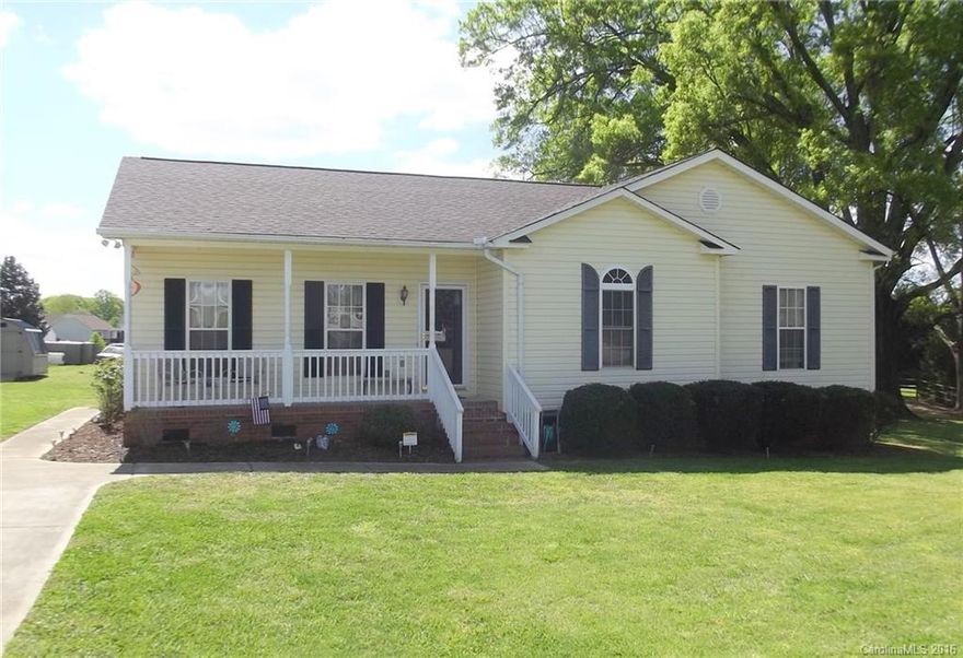 Move in ready with an open living room featuring vaulted ceiling & warm fireplace.  Bright, white kitchen with expansive counters & cabinets on three sides. Brand new laminate flooring in kitchen, LR & DR. 2 bedrooms with large closets.  Master Suite with 3 closets & Garden Tub.  Loads of storage throughout with a spacious laundry room & shelves galore. Freshly stained deck, new AC, new roof & a huge level acre lot. This home is too perfect to last long so make sure to see it before is gone!