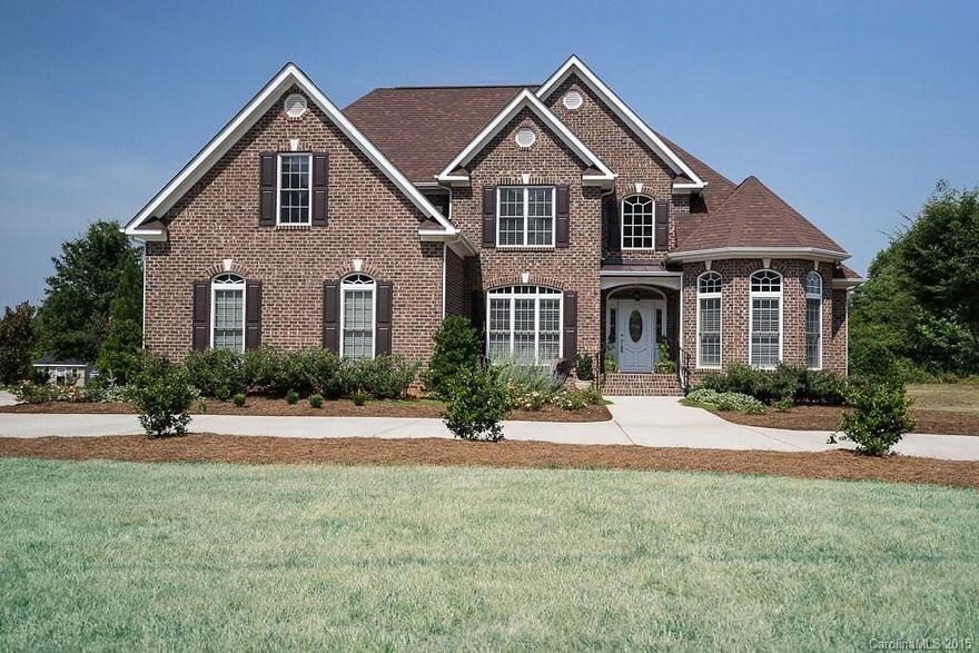 Beautifully maintained, this Full Brick Custom Home w/Open Floor Plan, is in a Quiet Area w/ private back yard. This Retreat boasts of Upgrades incl HW flooring along the main level. The Fam. Rm has a Gas FP & the Lg Eat in Kitchen has tons of Custom Cabs, SSL High-end Appl., Granite C-Tops, & a Spacious Island.  M on M, w/dbl tray ceiling, offers His/Hers Closets & Vanities along w/ Sep Shower & Whirlpool.  Lg Bonus offers closet for 4th bedroom & 2nd Master w/en-suite up.  Home Warranty Incl!