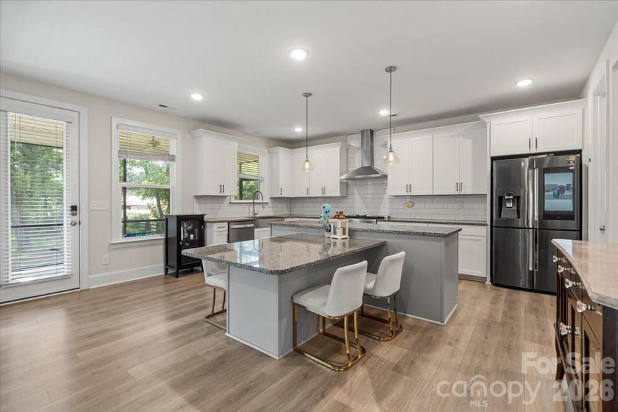 Escape the subdivision. This is the one you've been waiting for — a fully loaded, modern farmhouse on a private acre in the heart of Clover with no HOA, no city taxes, and top-rated Clover ISD schools.

Built in 2022 by Rykar Homes, this 5-bedroom, 4-bath home delivers the space, privacy, and quality finishes that simply don't exist at this price point inside a neighborhood. From the moment you walk in, the craftsmanship is evident — oak tread stairs, a slate fireplace with rustic wood mantle, and a chef's kitchen that was built to actually cook in. The 36" Verona dual fuel range, massive granite island with built-in table, oversized walk-in pantry, and stainless appliances make this kitchen the centerpiece of the home.

The layout works for real life. A main-level guest bedroom and full bath handle in-laws or visitors without disruption. A private office with French doors is ready for remote work or homeschooling. Upstairs, the owner's suite is a true retreat — tray ceiling, dual granite vanities, and a walk-in closet that delivers. Three additional bedrooms, two full baths, and a bonus room give everyone their own space.

Step outside to a screened rear porch overlooking your own acre of trees. No HOA telling you what to do with it.

Tankless water heater. Moen fixtures throughout. Network-ready infrastructure. Conventional, VA, and cash financing welcome.