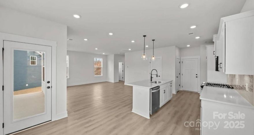 This move-in ready home at Farms at Bellingham offers a thoughtfully designed layout that prioritizes livability, efficiency, and timing certainty. Featuring 1,929 sq. ft., 3 bedrooms, 2.5 baths, a loft, and a 2-car garage, this home is ideal for buyers seeking new construction without a long build timeline.

The right-sized footprint allows the home to live comfortably while preserving usable outdoor space, creating a balanced indoor-outdoor experience. A covered rear porch extends the living area and provides a comfortable place to enjoy the yard year-round.

The open-concept main level includes luxury vinyl plank flooring, a spacious great room with gas-log fireplace, and a well-appointed gourmet kitchen with quartz countertops, an extended island, 42-inch cabinets, wall oven, and gas cooktop. The layout flows naturally and feels open without wasted space.

Upstairs, you’ll find three bedrooms, a versatile loft, an upper-level laundry room, and a private primary suite with tray ceiling, walk-in closet, and an upgraded tiled walk-in shower. Each space is designed to support everyday living with comfort and flexibility.

Farms at Bellingham is an intimate community of just 42 homes, offering a connected neighborhood feel while remaining close to everyday conveniences. A greenway entrance adjacent to the community provides direct access to walking trails, open green space, a dog park, and fitness stations.

Conveniently located approximately 5 miles from downtown Mooresville and downtown Davidson, with Lake Norman just 15–20 minutes away.

Limited-time incentives are available with use of the preferred lender, offering options to help reduce closing costs or monthly payments. Incentives subject to change or withdrawal without notice. Information deemed reliable but not guaranteed.