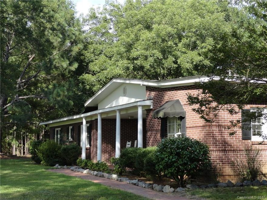 5.7 beautiful homesite, w/ trees, sunshine, & sweet wild life. Peace & tranquility - the first words that come to mind. If you're tired of the traffic and neighbors right next door, come enjoy this hidden gem w/in minutes of I-77.  Close enough to the interstate to get to restaurants and shops, far enough away to have a little slice of country! Bring the horses, install a pool, no hoa!  One New heat pump- new gas logs!  Seller to replace second heat pump and roof before closing.