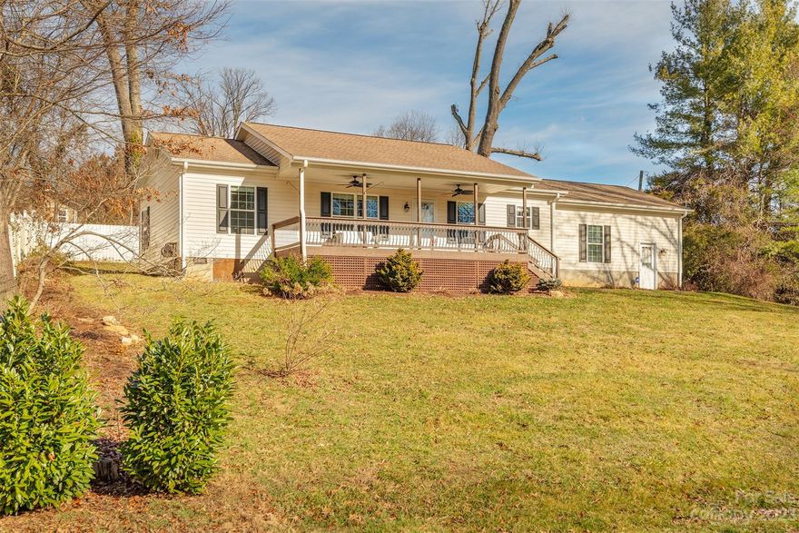 So much to love in this highly-sought walkable downtown Weaverville home! This move-in ready, updated, 2 bedroom+bonus/flex room has 9' ceilings, beautiful hardwood floors, solid wood kitchen cabinets, granite countertops, tile backsplash, updated stainless appliances, tile kitchen/laundry/bath floors, updated bathrooms, a primary bedrooms suite complete with dual vanities, custom tile shower, a second bedroom plus a separate office/bonus room. Great living flow from the spacious 2-car side load attached garage where you can easily transfer groceries to the kitchen. Entertain by the cozy gas fireplace or sit and drink some tea on the covered front porch. Walkability and access to all things Weaverville make this perfect for all generations! There is a separate tractor/workshop with electricity and it's own garage door - perfect for the artist/hobbiest. Don't wait on this one!  Broker related to seller. Floor plan available.