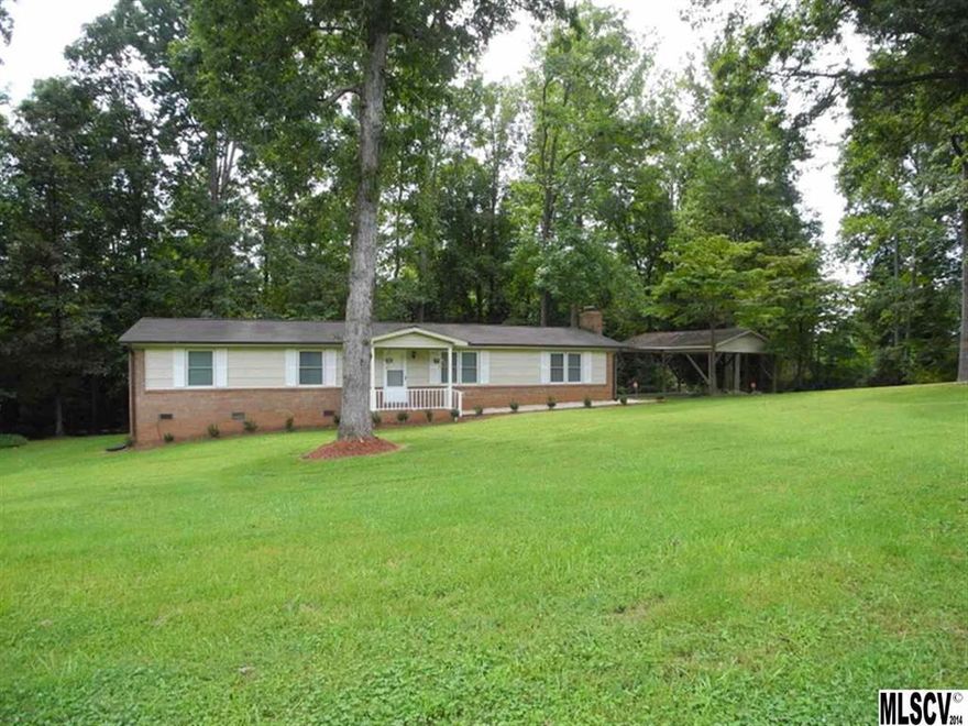 This home is all about quality of life. You have spacious living areas, 3 large bedrooms, 2 full baths, new deck, great kitchen, carport, & outbuilding. Home has had a remodel and looks fresh, new & ready for a new owner. You are close to town but low county taxes. Back off the road & very private. 100% USDA financing available on this great brick home with a private 1.6 acre lot.