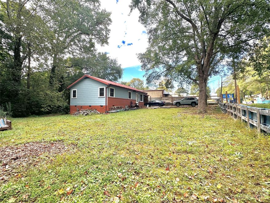 Commercial zoned property, currently used as residential. Could keep current use with restrictions or start your business right away. Restrictions apply, must check with city/county for intended used prior to offer. 
Wonderful opportunity for investors! Conveniently located halfway between downtown Belmont and downtown Mt Holly. I-85 in only 1 mile away, 20min to downtown Charlotte, Airport, WWC. Original hardwoods in most areas, Updated wiring and plumbing 2009, new HVAC 2018, exterior was painted 2020.
Attached 1 car carport, home sits on large (almost 1/2 acre lot) 12x16 wired outbuilding/workshop.