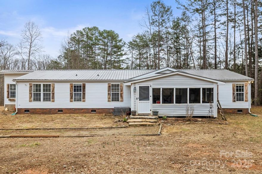 Welcome to this charming 3-bedroom, 2-bath home with a bonus guest room—previously used as a fourth bedroom—situated on 2.23 acres in a secluded cul-de-sac with no HOA! This home features a screened front porch, a spacious rear deck, and an open living area perfect for gatherings. The primary suite includes an en-suite bath with a garden tub and a walk-in closet.  Outside, you'll find a 2-car detached garage, two sheds (one with electricity), an animal pen, and a chicken coop—offering endless possibilities for hobbies or homesteading. Enjoy the tranquility of country living with the convenience of nearby amenities, along with the charm of rural life and the occasional sounds of nature and animals.  Schedule your showing today! Home sold as-is.  The following personal property comes with the home - patio furniture, Troy built 50" deck zero turn mower (needs a pulley), Blink camera system.