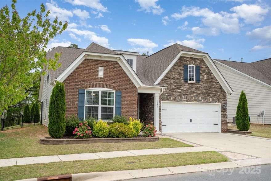 Welcome to this beautiful 1.5-story home in the highly desirable Massey neighborhood of Fort Mill, zoned for top-rated schools! The open floorplan features a spacious kitchen with granite countertops, tile backsplash, large island, walk-in pantry, and gas cooktop. The main-level primary suite offers custom closet built-ins and a luxurious bath with elegant tilework. A drop zone adds everyday convenience, and upstairs you'll find an additional bedroom, versatile bonus room and full bath. Enjoy outdoor living in the fenced backyard with a screened in porch area, expansive paver patio and built-in firepit. Massey’s resort-style amenities include a large pool with waterslide and lazy river, fitness center, community movie theater, and recreation area. All just minutes from I-77 and charming downtown Fort Mill! Schedule a showing today!