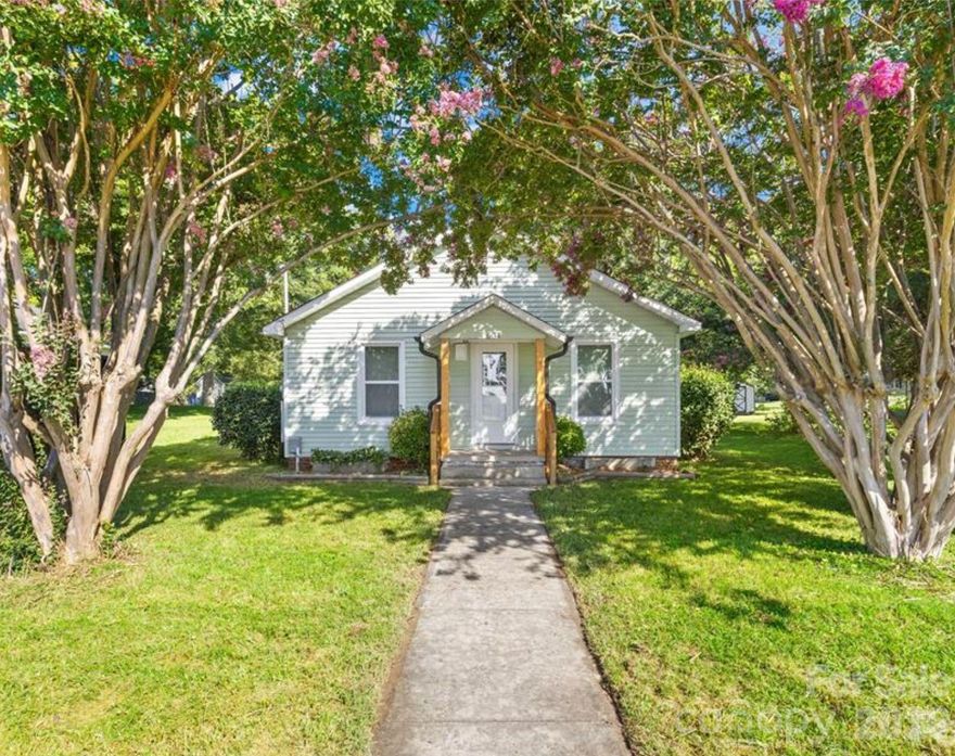 Small-Town Charm, Big-City Access. This 1940s bungalow perfectly blends vintage character with the "lock-and-leave" lifestyle today’s buyers crave. Thoughtfully updated and exceptionally low-maintenance, this home is an ideal fit for first-time buyers, downsizers, or anyone looking for a manageable, modern space in the heart of Landis. Don’t let the square footage fool you—every inch of this home is utilized for maximum efficiency. The classic layout features interconnected rooms typical of its era, creating an intimate and cozy flow. Move-In Ready, so you can rest easy knowing all major updates were completed within the last three years (including a new architectural shingled roof in 2023). Modern Interiors with durable LVP flooring runs throughout the entire home—no carpet to maintain! The flexible Layout, with 3 bedrooms, giving you plenty of room for a home office or guest setup. The exterior is designed for both relaxation and utility, with double the potential. Enjoy a fully fenced-in backyard for pets or play, plus an additional plot of land extending past the fence line for gardening or future projects. Relax on the covered back deck, offering a shaded retreat for morning coffee or evening grilling.  A dedicated storage shed provides plenty of room for tools and equipment. Located at 604 S Zion St, you are just a short distance from the best of downtown Landis and a short drive to the bustling hubs of Kannapolis and Mooresville. Leave the car and stroll over to local favorites like Willowbrook Grounds for specialty coffees, Landis Dairy Bar for a classic treat, or grab a meal at Fusion Mexican Grill. You’re minutes from Lake Corriher Wilderness Park, which offers fishing, disc golf, and scenic hiking trails. Nearby Attractions include the revitalized Downtown Kannapolis, with shops and breweries, home to the Cannon Ballers - Atrium Health Ballpark and the historic Gem Theatre. Commuter Friendly, with quick access to I-85 and I-77, your commute to Concord, Salisbury, Mooresville, or Charlotte is a breeze. This is a rare opportunity to own an affordable, updated, historic-style home that won’t spend your entire weekend on maintenance. Come see why this Landis gem is the perfect place to call home!