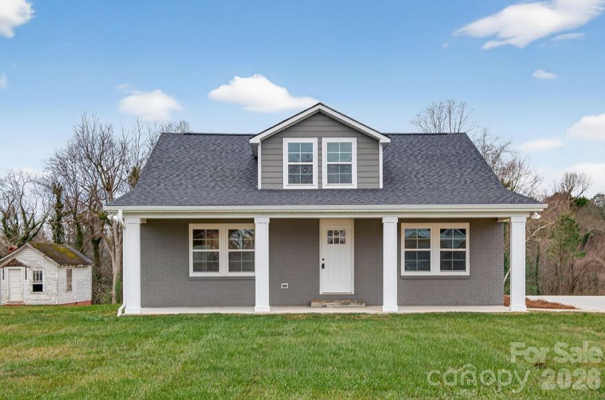 HEART OF GRANITE FALLS-Don't let the year built fool you. This spacious 1940's home has been totally renovated. A true show stopper featuring up to 5 full bedrooms, 2 1/2 baths! The main living area is open to the dining & kitchen, making a perfect gathering place for family/friends. The kitchen boasts gorgeous granite countertops, subway tiles, custom cabinetry, stainless steel appliances, including a side by side refrigerator...and a pantry for stocking up. The owner's suite is conveniently located on the main level & features an all new stunning en suite bathroom with enormous walk-in shower, granite countertops, fixtures & more. In addition, another bedroom is also located on the main level. This room could be used as a flex space, such as an office, nursery, etc.  Also, located on the main level is a 1/2 bath for guests, & a laundry room. Upstairs, there are 3 ample bedrooms, all with walk-in closets & a full bathroom to share. Gorgeous hardwood floors flow throughout the entire home, except for the beautiful tile floors in the bathrooms. Everything except the brick exterior, foundation & framing are new. A list of new renovation items include a new architectural roof, 2 HVAC systems for main & upper level, plus new ductwork, electrical (no old wiring), new plumbing (no old plumbing), includes new plumbing all the way to the street connecting to city sewer; window replacements, interior & exterior doors, sheetrock; new hardwood flooring throughout main level--upstairs are original but refinished; all light fixtures, & plumbing fixtures. All items have been permitted & approved by Caldwell County Inspectors. In addition, the driveway & patio are also new. This is a true turnkey home and ready for its new owners. Conveniently located near schools, restaurants & easy access to HWY 321 for traveling to Hickory, Charlotte airport, or northward to the moutains!