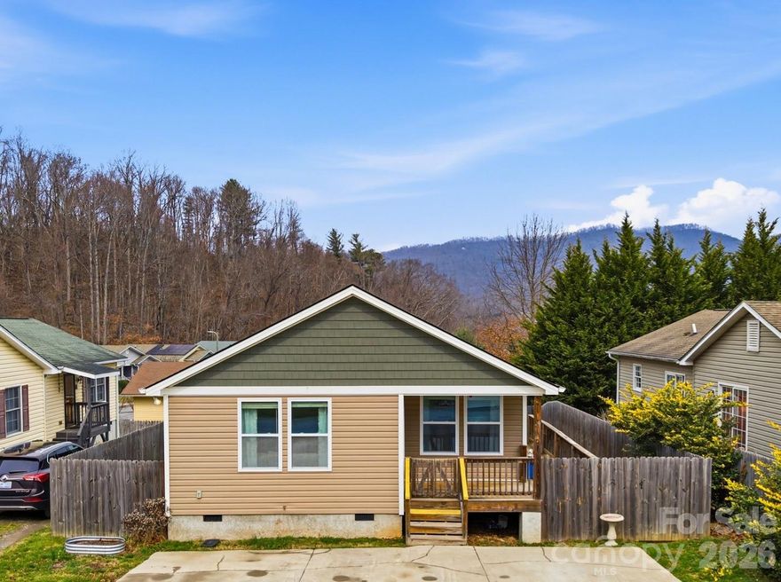 Take a look!  If you love to Walk, Run or Bike!  Check out this home that is a 5 min walk to the soon to be "Beacon Park" Complex! Planned to open Summer of 2026 at the old Beacon Mfg site and only a short 5 minute walk from this great home in a great location! Settled in a peaceful neighborhood between Asheville and Black Mountain this sweet Swannanoa home is move in ready. Make it your primary, summer or investment home.  Park on your private concrete parking pad and walk onto the gated and fenced covered deck where you can enjoy your morning or evening beverage while taking in the surrounding mountain air.  Entering the home you will find an open floor plan of the living room, kitchen and dining room.  The kitchen features a nice pantry and granite countertops. A breakfast bar is adjacent to your formal dining area. Going down the hall on your left, you will find 2 bedrooms with a full bathroom separating them. Opposite side of the hall you will find of the laundry room and the primary bedroom with a full bath and large walk in closet.  The sides of home and backyard are totally fenced in with privacy fencing.  In addition you will find a garden shed to store your tools and other items.  This is a must see, well cared for home. Sellers to offer up to $5000 in buyer closing costs.
