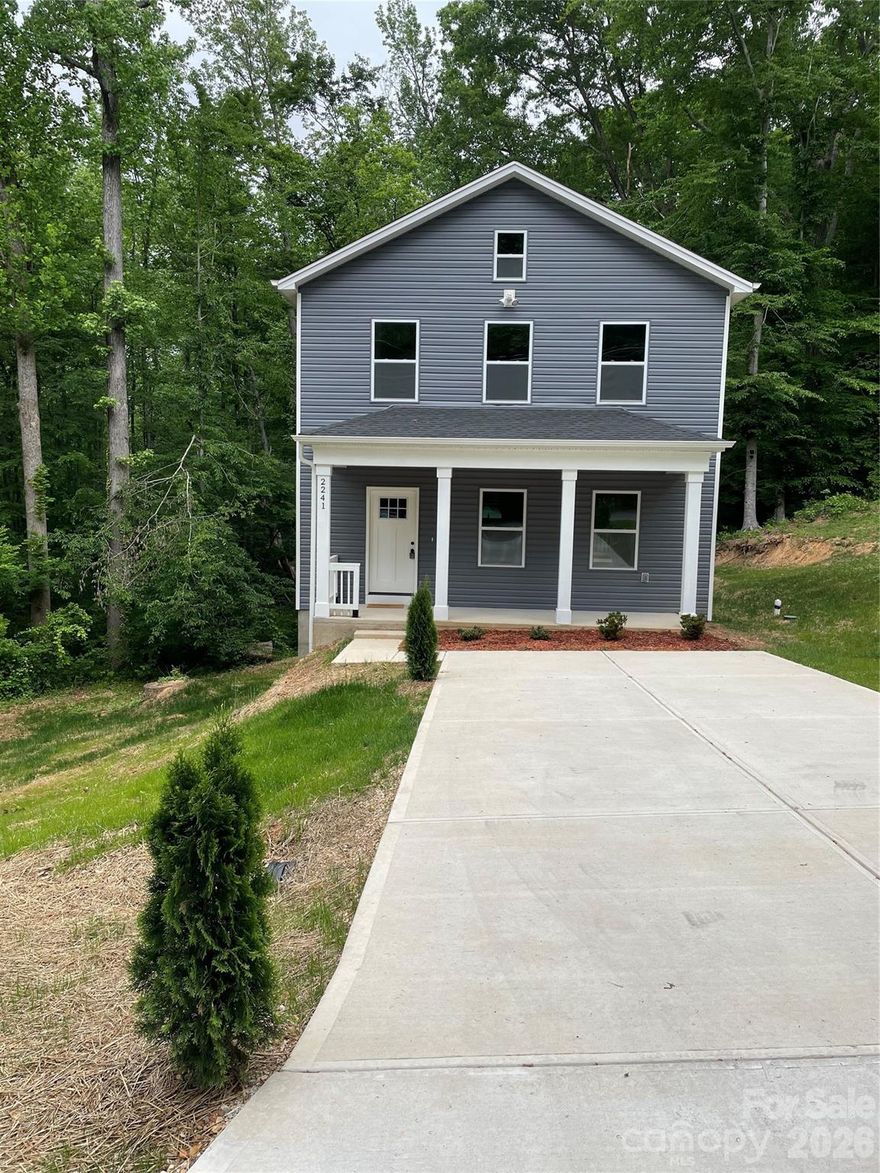BACK ON MARKET - No fault of sellers, buyers financial situation changed. Perfection - The story behind this New Construction home. This 2-story home has an open floor plan that gives you the space to fulfill your every need. As you arrive you are welcomed by a front porch with a wood plank ceiling setting the tone for the thoughtful details found throughout the home. As you enter the front door into an inviting foyer that naturally draws you further inside, the vinyl floors immediately catches your attention. The flooring continues seamlessly throughout the entire home. The amount of details that are handcrafted into this home are endless. Natural light fills every corner of the house, highlighting the craftsmanship and attention to detail throughout. The spacious living room with 9 ft ceilings flows effortlessly into the kitchen, creating the perfect setting for entertaining and gathering. The kitchen features solid surface countertops and a large island that gives you that granite like finish. All completed with stainless steel appliances. Want to brighten it up some more? You have recessed lighting to show off that bright and modern living space. Just off the dining room, you have a charming wood deck to enjoy your backyard and extend your space outdoors. The main level also includes a dedicated laundry room with additional storage for everyday convenience, but it doesn't stop there. The second level is enhanced by a modern chandelier and more natural light to see every detail. The master bedroom has a huge walk in closet and a private bathroom with dual sinks. You also have two additional bedrooms and a second full bathroom. With its convenient location near major retailers and the thoughtful use of space throughout, this home is truly beautiful inside and out. Go ahead, schedule your showing and come experience it for yourself before it’s gone. Floodplain located at the rear of the property.