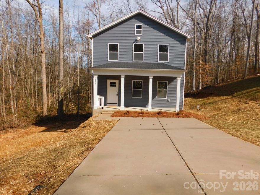Perfection - The story behind this New Construction home. This 2-story home has an open floor plan that gives you the space to fulfill your every need. As you arrive you are welcomed by a front porch with a wood plank ceiling setting the tone for the thoughtful details found throughout the home. As you enter the front door into an inviting foyer that naturally draws you further inside, the vinyl floors immediately catches your attention. The flooring continues seamlessly throughout the entire home. The amount of details that are handcrafted into this home are endless. Natural light fills every corner of the house, highlighting the craftsmanship and attention to detail throughout. The spacious living room with 9 ft ceilings flows effortlessly into the kitchen, creating the perfect setting for entertaining and gathering. The kitchen features solid surface countertops and a large island that gives you that granite like finish. All completed with stainless steel appliances. Want to brighten it up some more? You have recessed lighting to show off that bright and modern living space. Just off the dining room, you have a charming wood deck to enjoy your backyard and extend your space outdoors. The main level also includes a dedicated laundry room with additional storage for everyday convenience, but it doesn't stop there. The second level is enhanced by a modern chandelier and more natural light to see every detail. The master bedroom has a huge walk in closet and a private bathroom with dual sinks. You also have two additional bedrooms and a second full bathroom. With its convenient location near major retailers and the thoughtful use of space throughout, this home is truly beautiful inside and out. Go ahead, schedule your showing and come experience it for yourself before it’s gone. Floodplain located at the rear of the property.