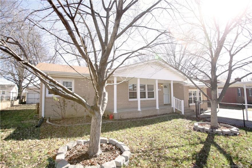 Investment opportunity!! Full brick ranch home conveniently located to schools, shopping, dining and entertainment. Three bedrooms plus bonus/rec. area.  New flooring in master suite. Refrigerator, washer and dryer conveys. Two storage sheds, carport and fully fenced yard.