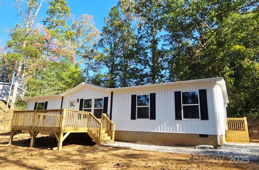 Brand New & Move-In Ready in Fairview! Energy efficient. Low-cost utilities. 
Experience modern mountain living in this beautifully upgraded 3BR/2BA energy-efficient e-built home! The open floor plan offers a bright, welcoming interior with scenic views in every direction. 
Whip up your favorite meals in the stylish kitchen featuring an island with bar seating, ample cabinetry, and thoughtful upgrades—perfect for entertaining. The spacious primary suite includes a walk-in closet and a dual-sink bath for added comfort.
Step outside to your large 12x16 deck—ideal for morning coffee, evening gatherings, or simply soaking in the peace and beauty of the surroundings.
Located just a short stroll to Turgua Brewery and Cane Creek, where you can toss in a fishing line, this home is tucked away yet convenient to town. Built with 2x4 walls for durability and efficiency, it offers both quality and value. Watch the video and see the energy efficiency this home offers!
Heat Pump water heater for energy savings.