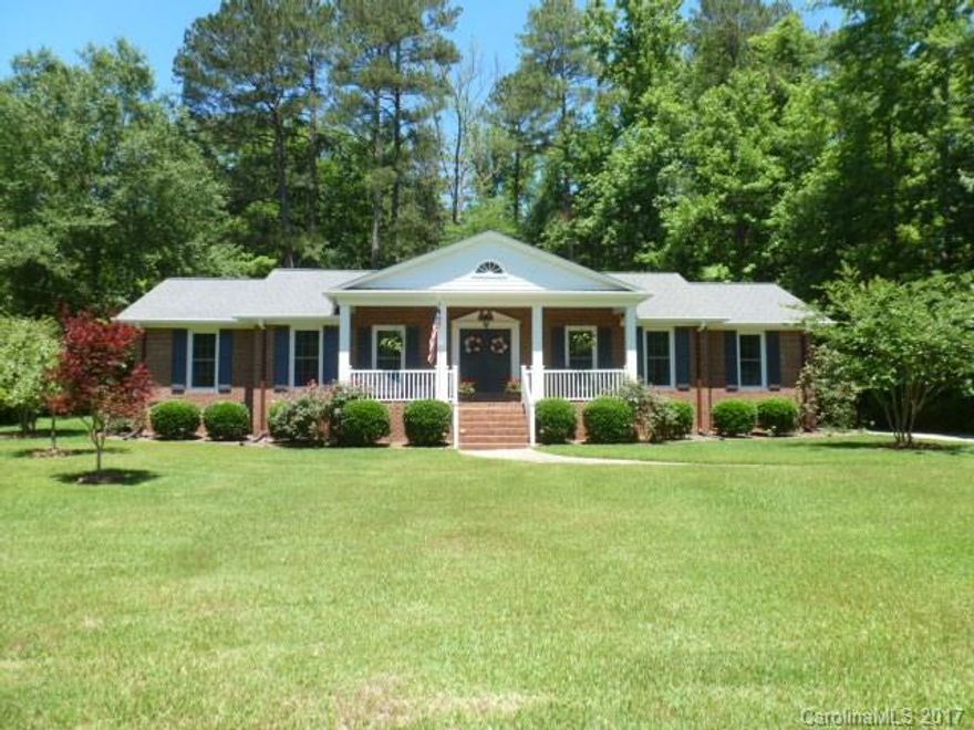 Beautifully landscaped, this 3 bedroom, 2 bath all brick home features, foyer, fml Living room, fml dining room, den w/Fpl/Gas logs, kitchen with appliances included, laundry room, large front porch, dbl carport, great back yard, 2 storage buildings. Replacement windows. Community pool. This home is the whole package.