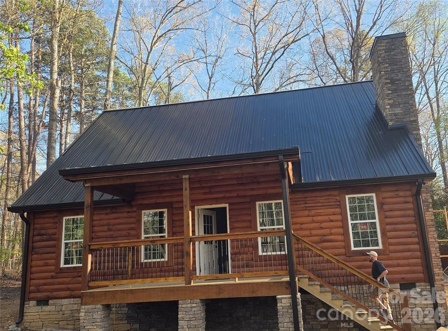 New custom built log cabin style farmhouse by Roberts Custom Homes. The large front and back porches, the gas fireplace,  and a vaulted  tongue and groove ceiling over the great room are just some of the features that make this place special. A short walk to the neighborhoods private access to High Rock Lake (Pavillion with shelter house, fishing and small boat landing); less than 1 mile to public boat access and swimming area (Buddle Creek) and Holloway Church Road; and less than 3 miles to the new sports complex site and Southmont school. New appliances, smart house capable, tile bath and shower, privacy fence in back,  chain link fence around property, peaceful,  family friendly neighborhood, largely wooded surroundings. Good walking and biking neighborhood, good for birding, too.