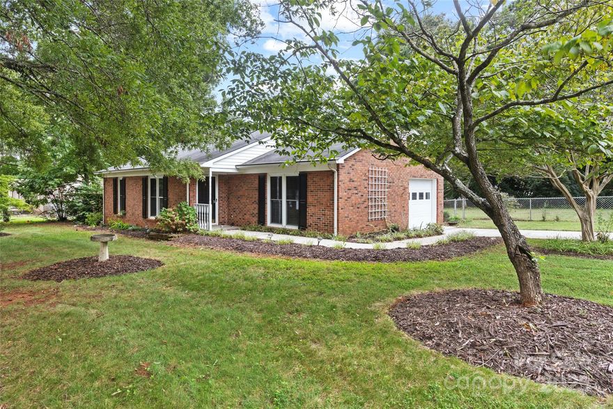 Charming full-brick ranch on a spacious half-acre lot with NO HOA—just minutes from vibrant Downtown Rock Hill’s Main Street, where you’ll enjoy shops, restaurants, breweries, bakeries, and community events.

This move-in ready home features fresh paint, vinyl plank flooring, and a desirable split-bedroom layout. The updated kitchen boasts quartz countertops(with additional counter seating space), subway tile backsplash, new stainless steel sink and faucet, a brand new stainless refrigerator and freshly painted white cabinetry. Brand new blinds! A dining area opens to the covered side porch, perfect for morning coffee or evening relaxation.

The private owner’s suite includes its own bath, and a laundry closet while the secondary bedroom offers a large walk-in closet. Additional highlights include a 1-car garage, oversized concrete driveway with plenty of parking, and two storage sheds in the fully fenced backyard. With modern upgrades, functional outdoor space, and close proximity to the bustling Main Street lifestyle, this home is truly a gem!