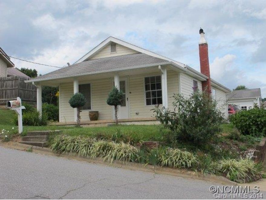 NO DOWN PAYMENT-Cozy 2 Bedrooms and one & 1/2 bath home with 2 car detached garage and workshop in town.  Easy commute to Asheville or Waynesville.  If you are looking for a maintenance free home, this is it.  New roof was installed in October 2014. Water is off