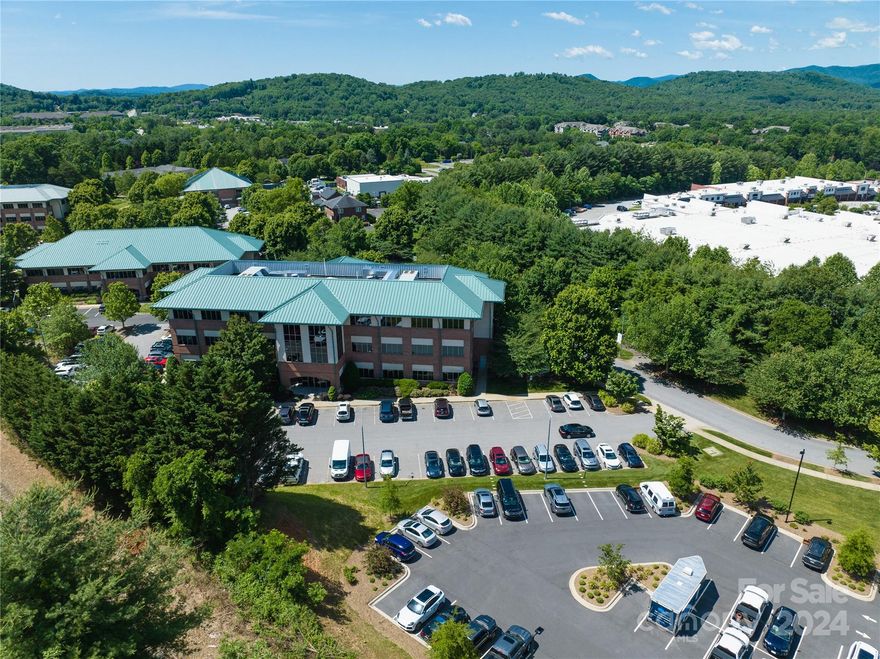 Located in Nettlewood Professional Park.  Ideal property for owner-user or retain tenant and hold as an investment opportunity:  Currently under lease. Tenant’s Lease runs until 2030 but will vacate upon notice should buyer wish to occupy.

Recently remodeled Class A office space offering a total of 10,969 SF of professional office condo available for sale.  Current layout offers 30 private office suites, 2 conference rooms, reception area, breakroom w/ kitchen, separate break/coffee stations, records storage, two restrooms, dedicated data closet, storage, and elevator access.

Turn-key professional office featuring high-end finishes, free on-site parking, monument signage, professionally managed condo association, third floor office condo with windows surrounding the space offering ample natural light and mountain views.  Ideally located to area shopping and restaurants and in close proximity for convenient access to I-40, I-26 and the Blue Ridge Parkway.