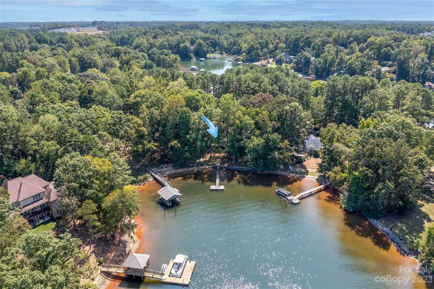 Very Sought-after Location on this waterfront lot. Very flat main channel lot with insane views. This lot is .88 acres with septic & well installed. Lot has deeded pier and dock that will need to be updated. Lot has a nice beach area for lounging around and watching the sunset. This property is located off Perth rd. and only 1 mile from Lake Norman High School. Grocery stores and restaurants are very close. Mobile home has 0 value. Agents please Due Diligence on septic & well. They have not been operational in Years. Ashley Rollins did soil evaluation for extending & moving septic system.
Property has a RV Hookup on site with septic & water & Electrical
Road is being paved..