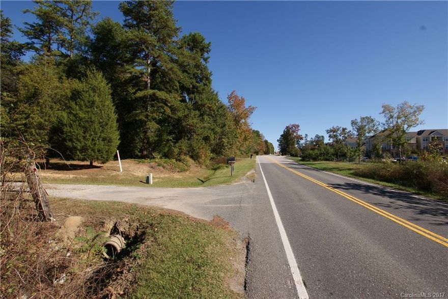 Total of 4.5 acres sits approximately 1300 feet from the corner of Pleasant Rd & Gold Hill - Zoning is currently RD-I,  300+ feet of road frontage on Pleasant Rd. Home and out buildings on property conveys at no value.  A septic and well currently service the existing home.